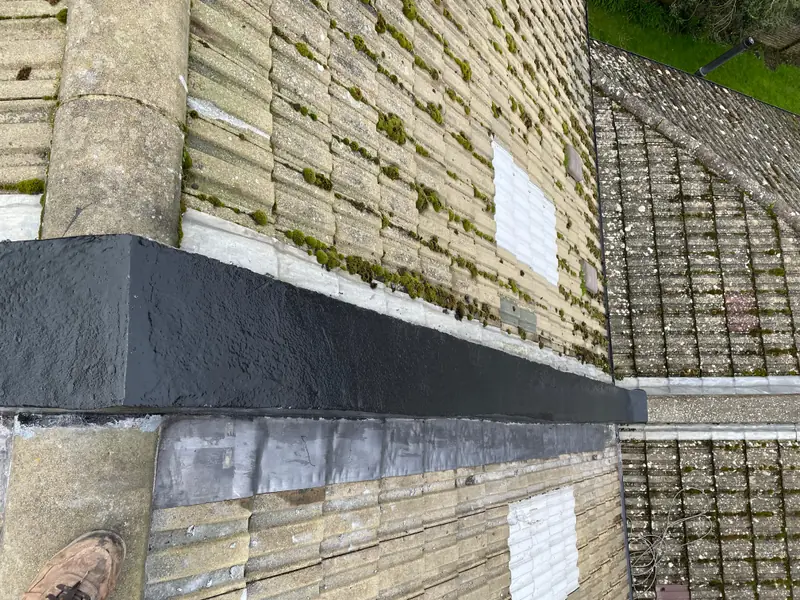 Repaired roof valley with new lead flashing